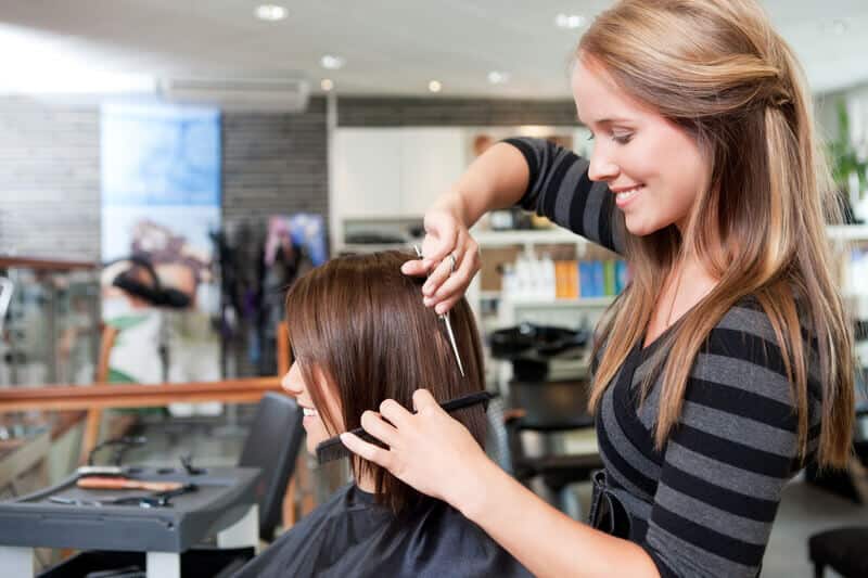 Stylist cutting clients hair.